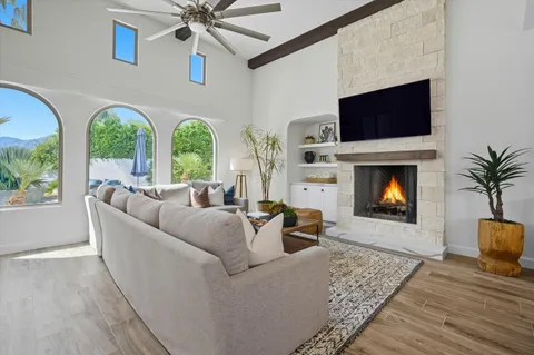 a view of hall way with furniture and window