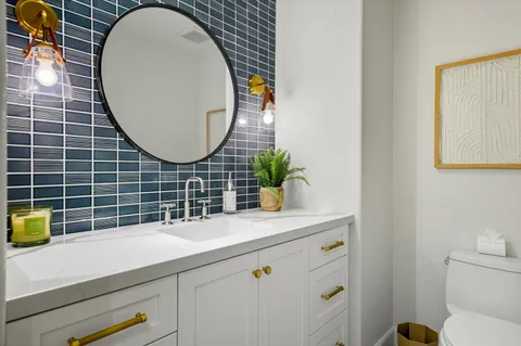 a bedroom with a bed couch and window