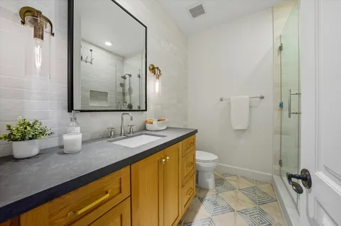 a kitchen with sink cabinets and wooden floor
