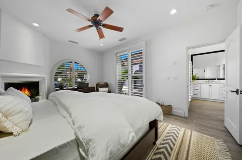 a bedroom with a bed and a fireplace