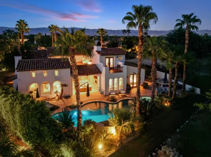 an aerial view of residential house with outdoor space and swimming pool
