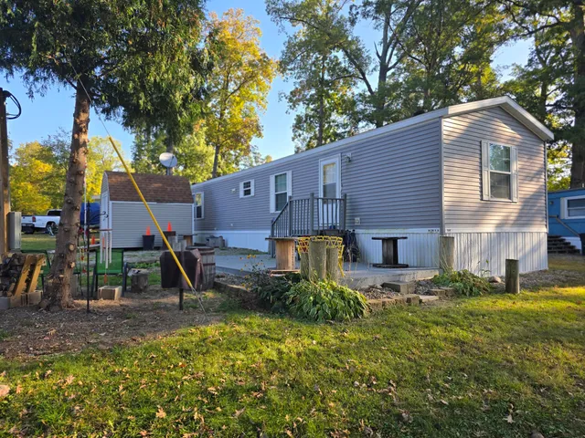 a backyard of a house with seating space