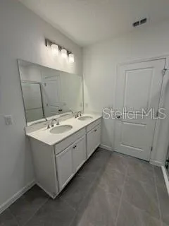 a utility room with a sink washer and dryer