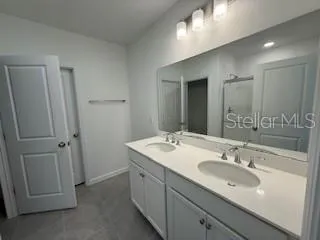 a bathroom with a sink and a mirror