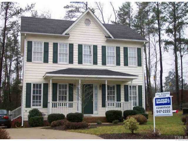 4308 Emmit Drive Raleigh, NC 27604 - Photo 1 of 1 a view of a white house with large windows and a table and chairs