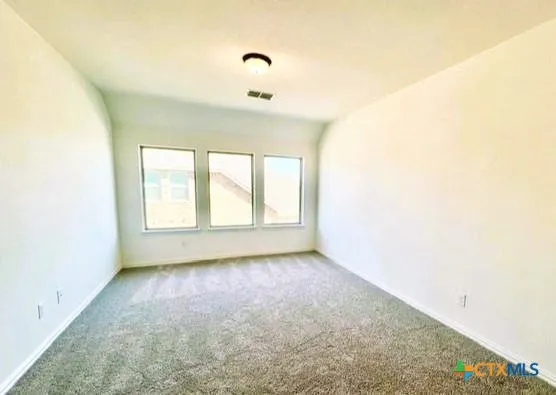 a large kitchen with stainless steel appliances kitchen island a stove a refrigerator a sink and a fireplace