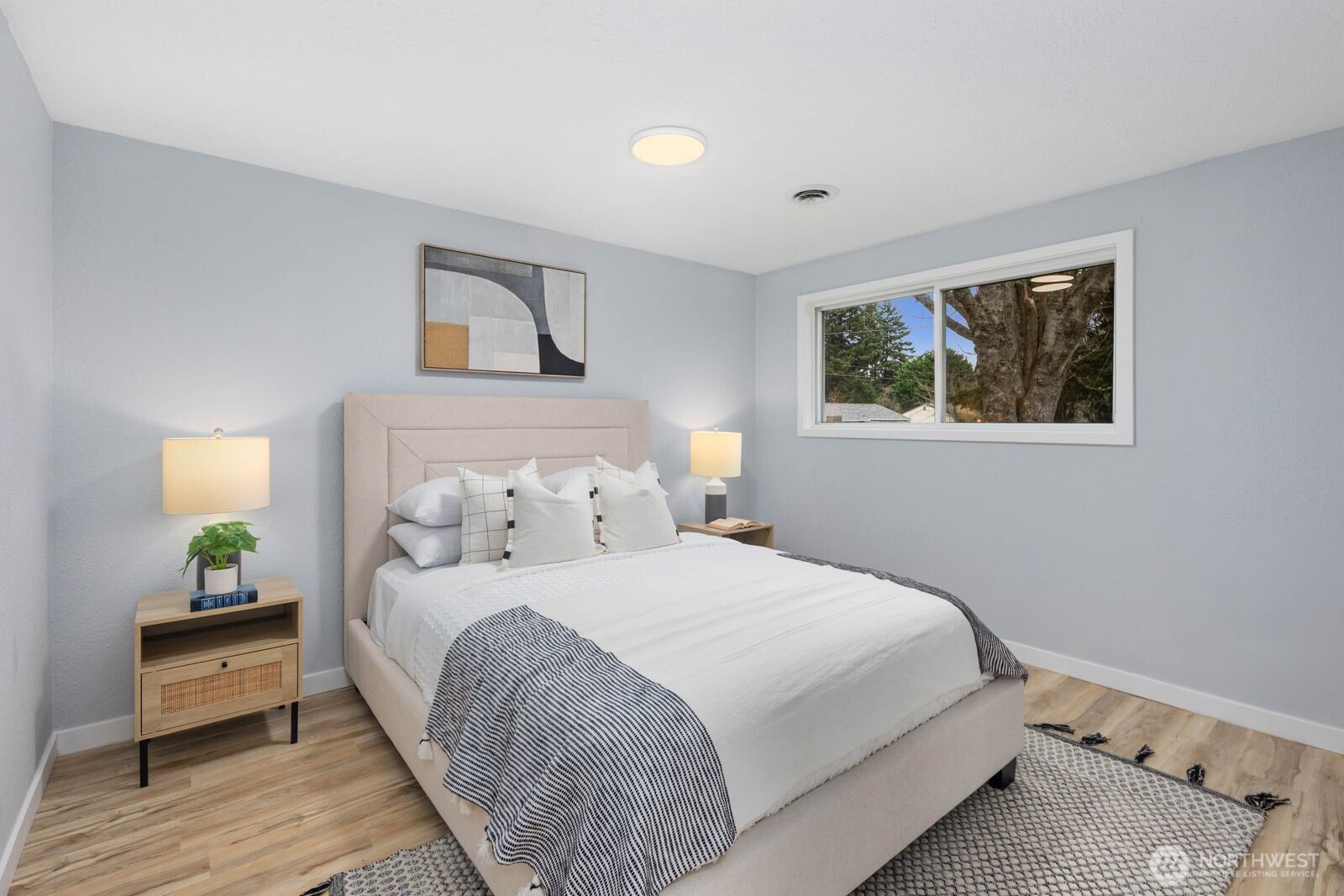 505 Southwest 305th Street Federal Way, WA 98023 - Photo 14 of 38 a bedroom with a bed and a lamp on dresser