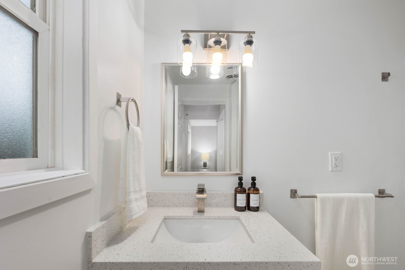 505 Southwest 305th Street Federal Way, WA 98023 - Photo 16 of 38 a bathroom with a sink and a mirror