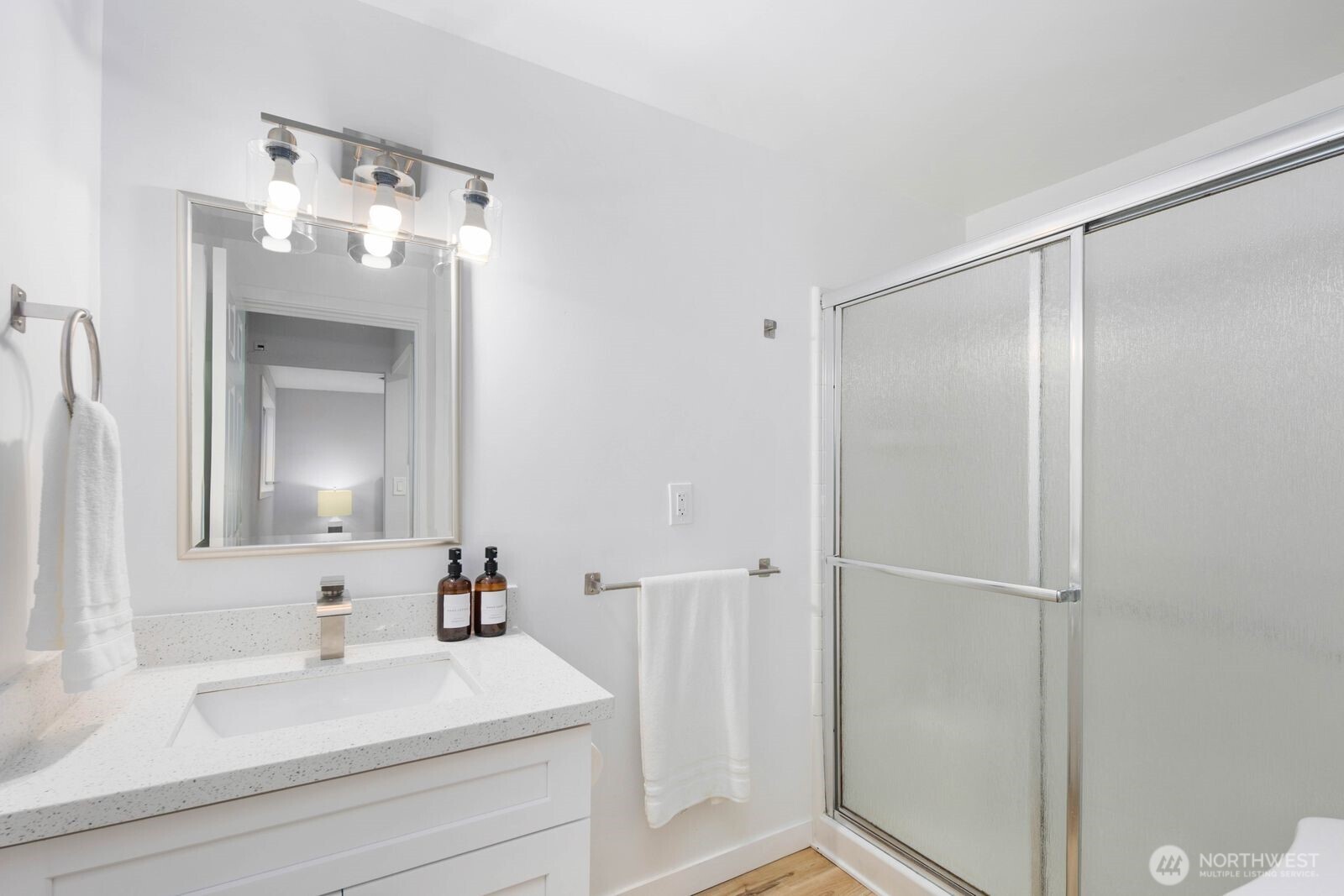 505 Southwest 305th Street Federal Way, WA 98023 - Photo 17 of 38 a bathroom with a sink and a mirror
