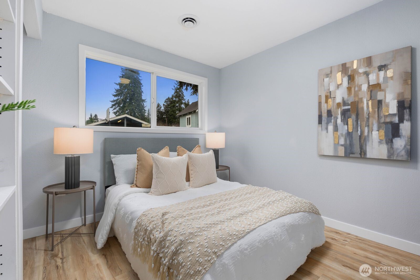 505 Southwest 305th Street Federal Way, WA 98023 - Photo 19 of 38 a bedroom with a bed and a painting on the wall