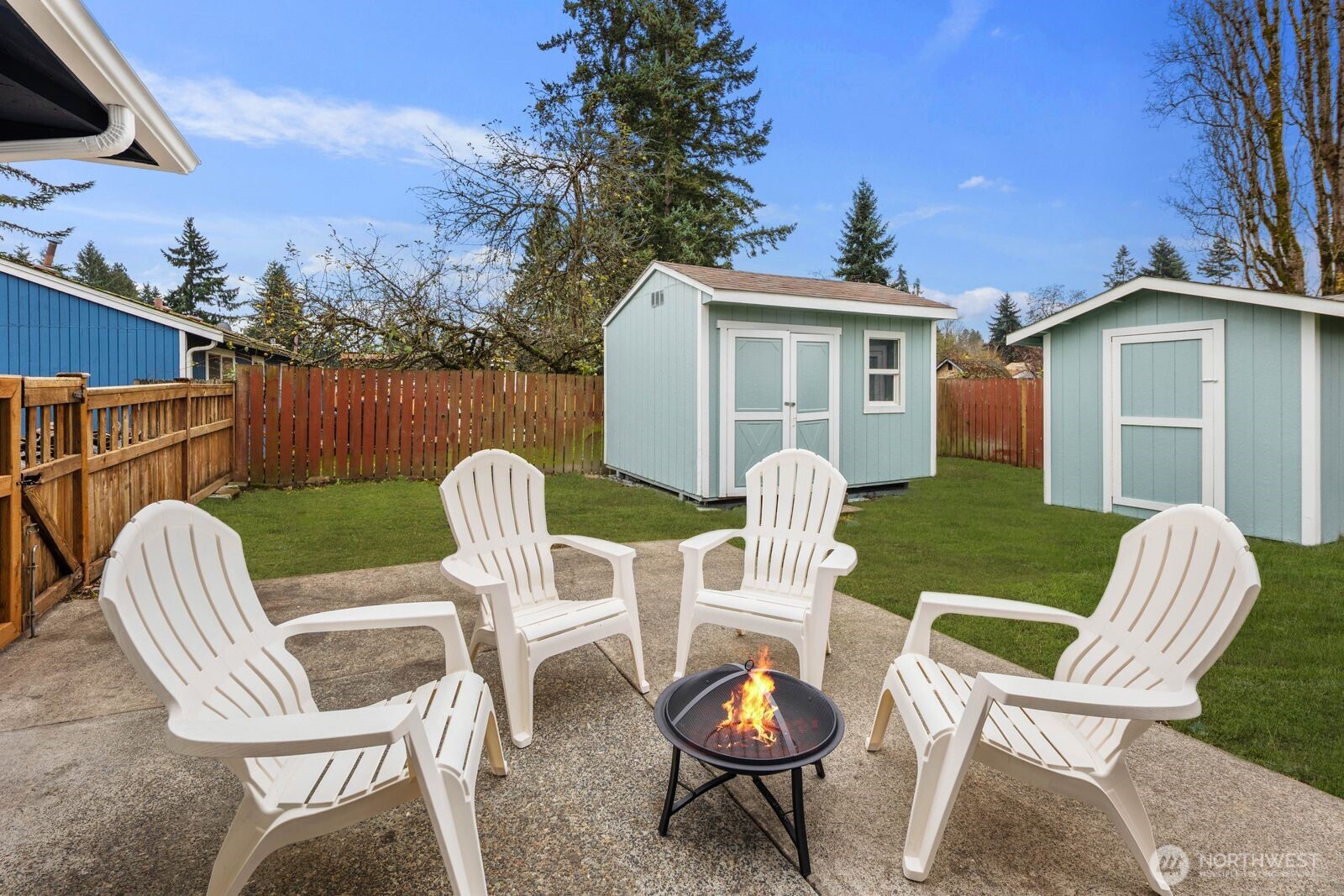 505 Southwest 305th Street Federal Way, WA 98023 - Photo 22 of 38 a view of a chair and table in backyard of the house