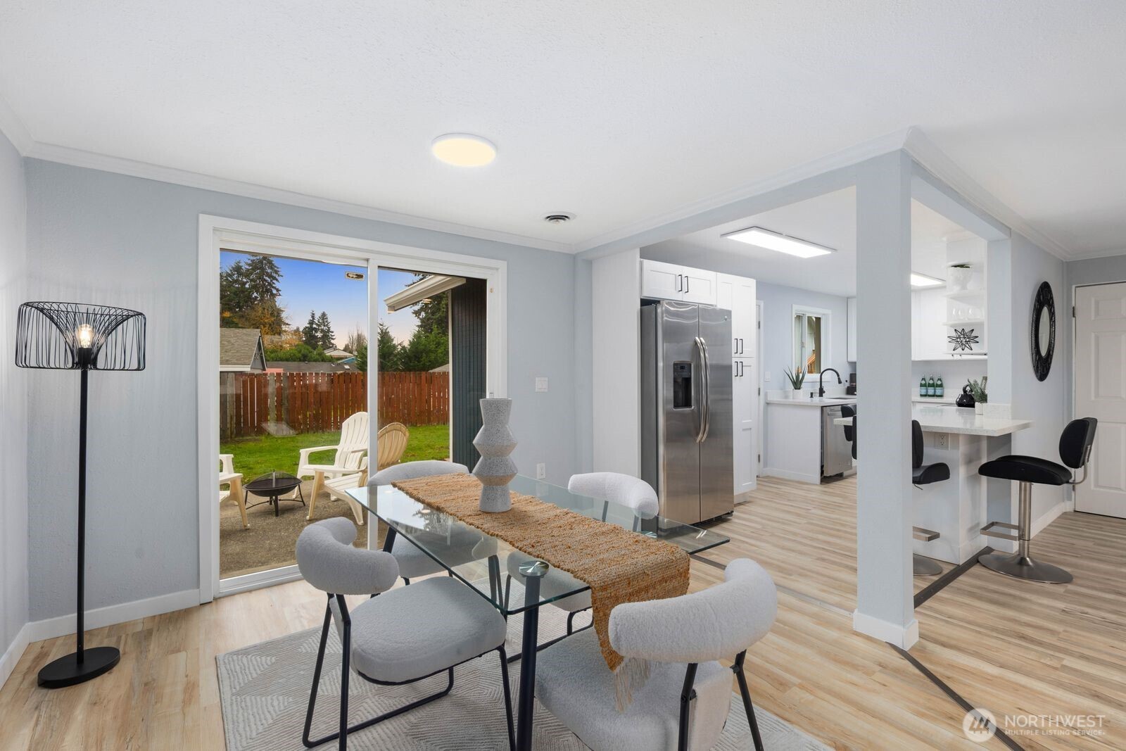 505 Southwest 305th Street Federal Way, WA 98023 - Photo 8 of 38 a view of a dining room with furniture window and wooden floor