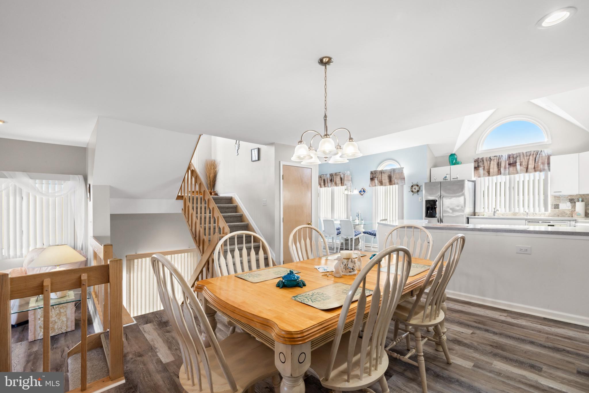 313 Gull Cove Brigantine, NJ 08203 - Photo 16 of 34 a view of a dining room with furniture and chandelier