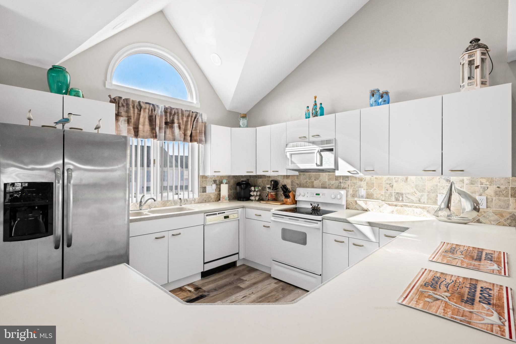 313 Gull Cove Brigantine, NJ 08203 - Photo 20 of 34 a kitchen with a sink cabinets and window