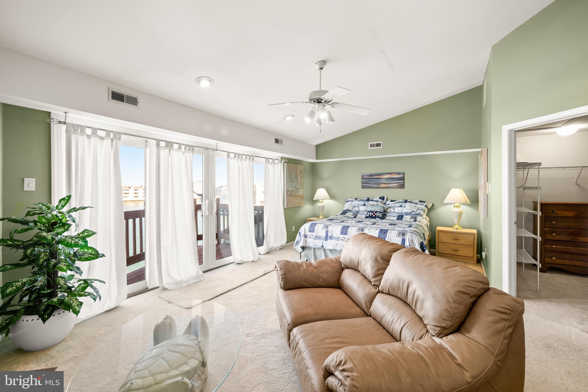 313 Gull Cove Brigantine, NJ 08203 - Photo 22 of 34 a living room with furniture and a chandelier