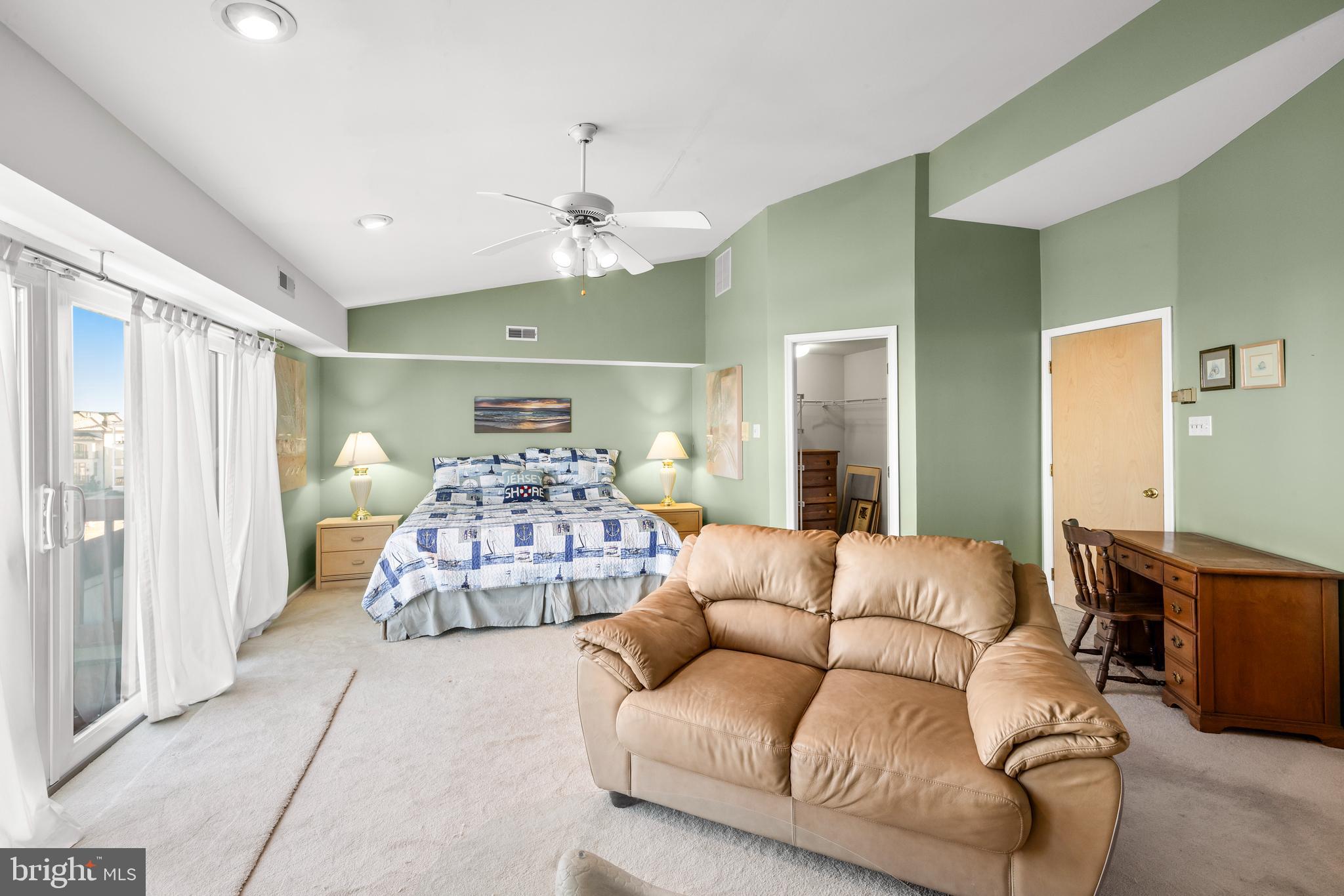 313 Gull Cove Brigantine, NJ 08203 - Photo 23 of 34 a living room with furniture and a chandelier