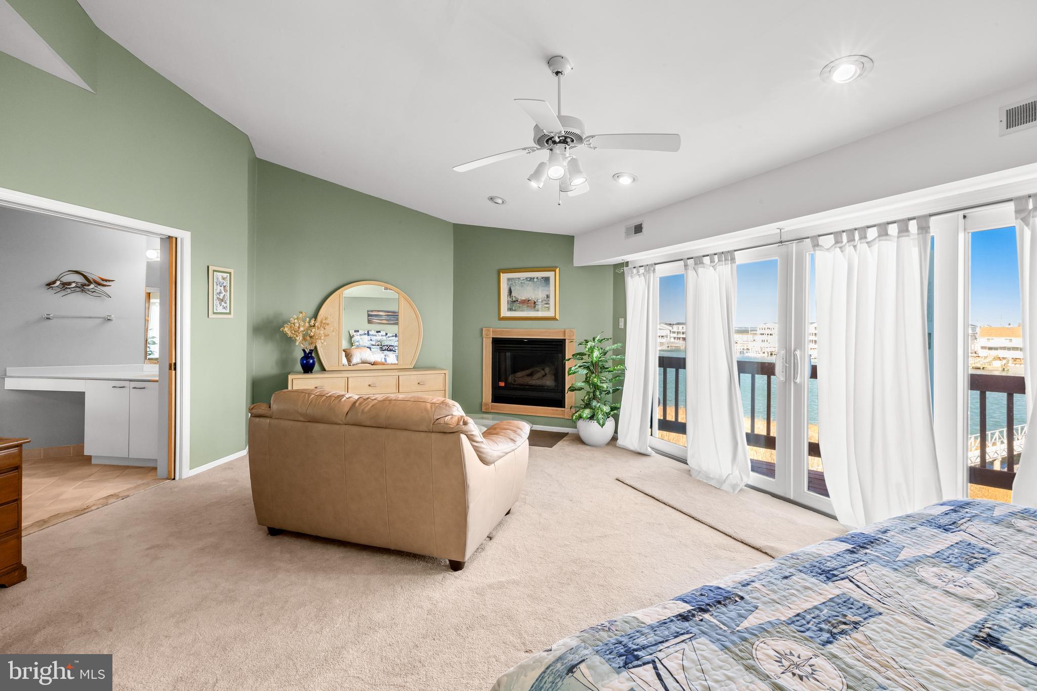 313 Gull Cove Brigantine, NJ 08203 - Photo 25 of 34 a living room with furniture and a fireplace