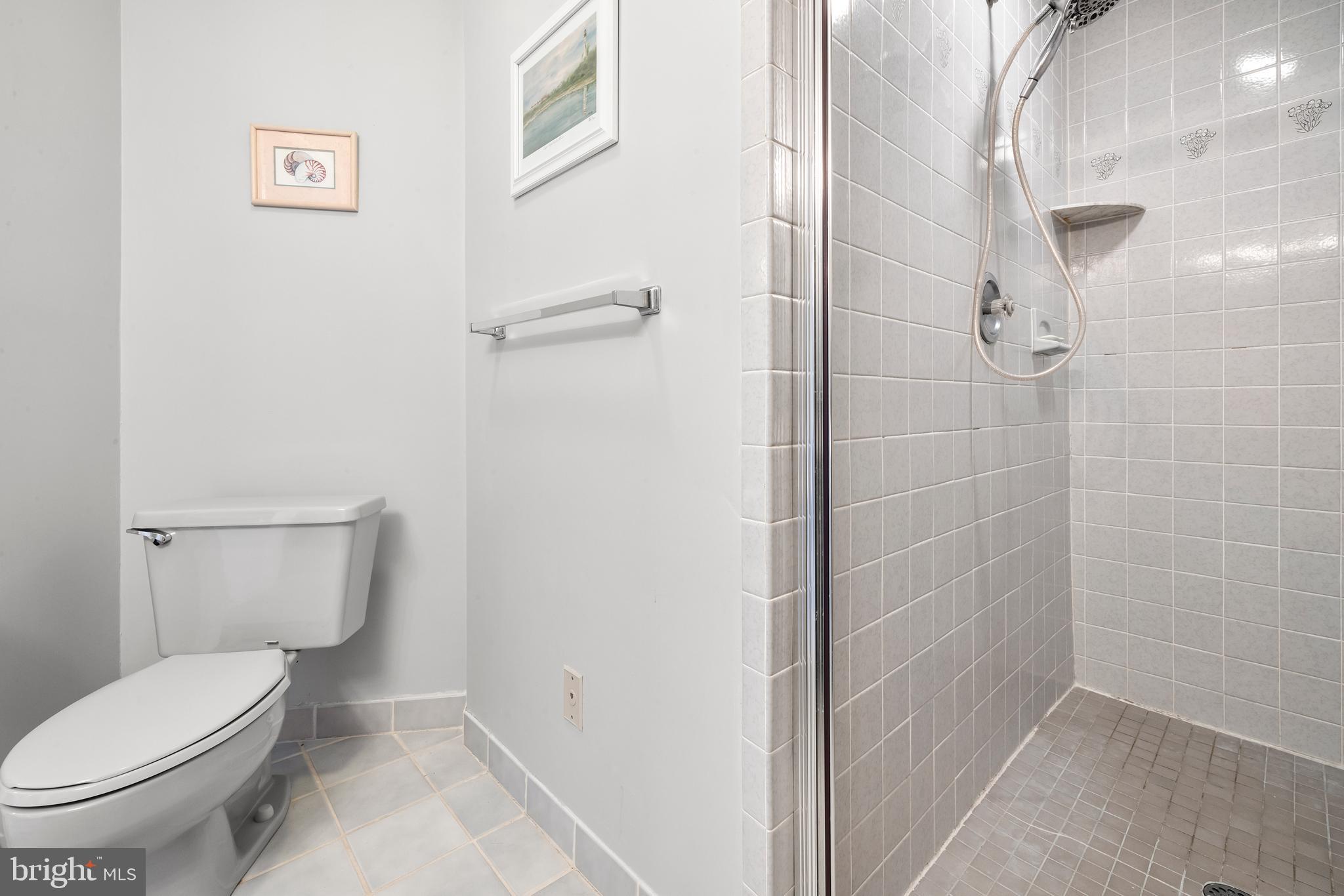313 Gull Cove Brigantine, NJ 08203 - Photo 27 of 34 a bathroom with a toilet and a shower