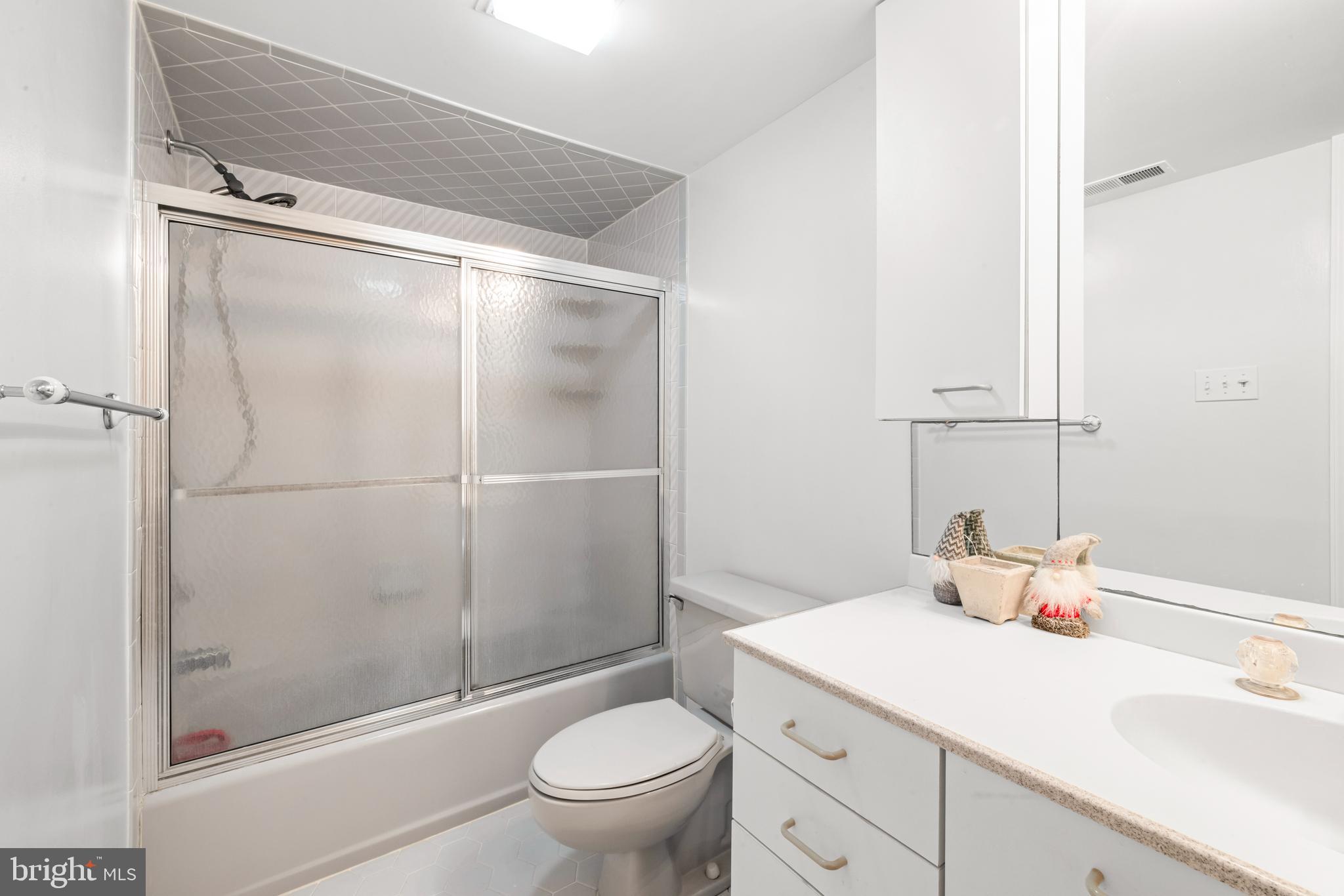 313 Gull Cove Brigantine, NJ 08203 - Photo 9 of 34 a bathroom with a sink toilet and shower