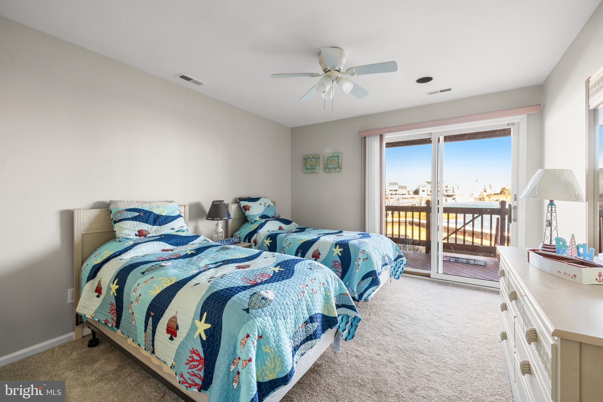 313 Gull Cove Brigantine, NJ 08203 - Photo 10 of 34 a bedroom with two beds and a large window