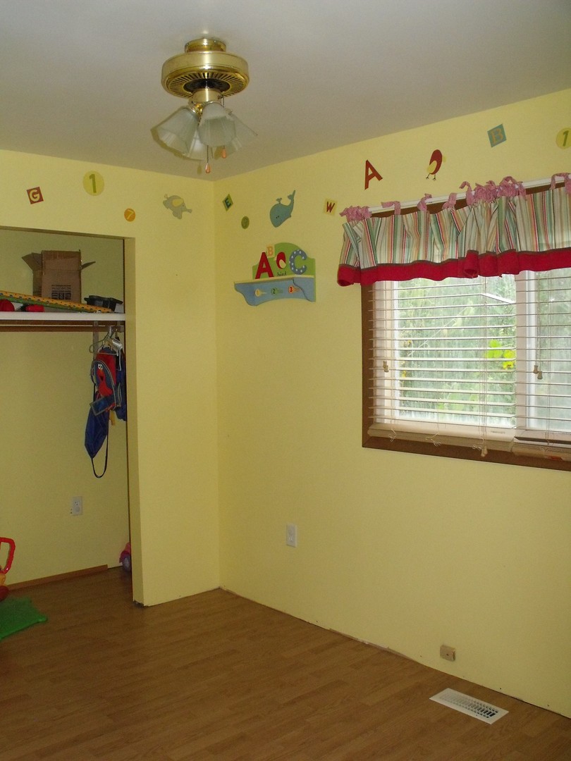419 Tallman Avenue Romeoville, IL 60446 - Photo 7 of 10 a view of a room with gym equipment