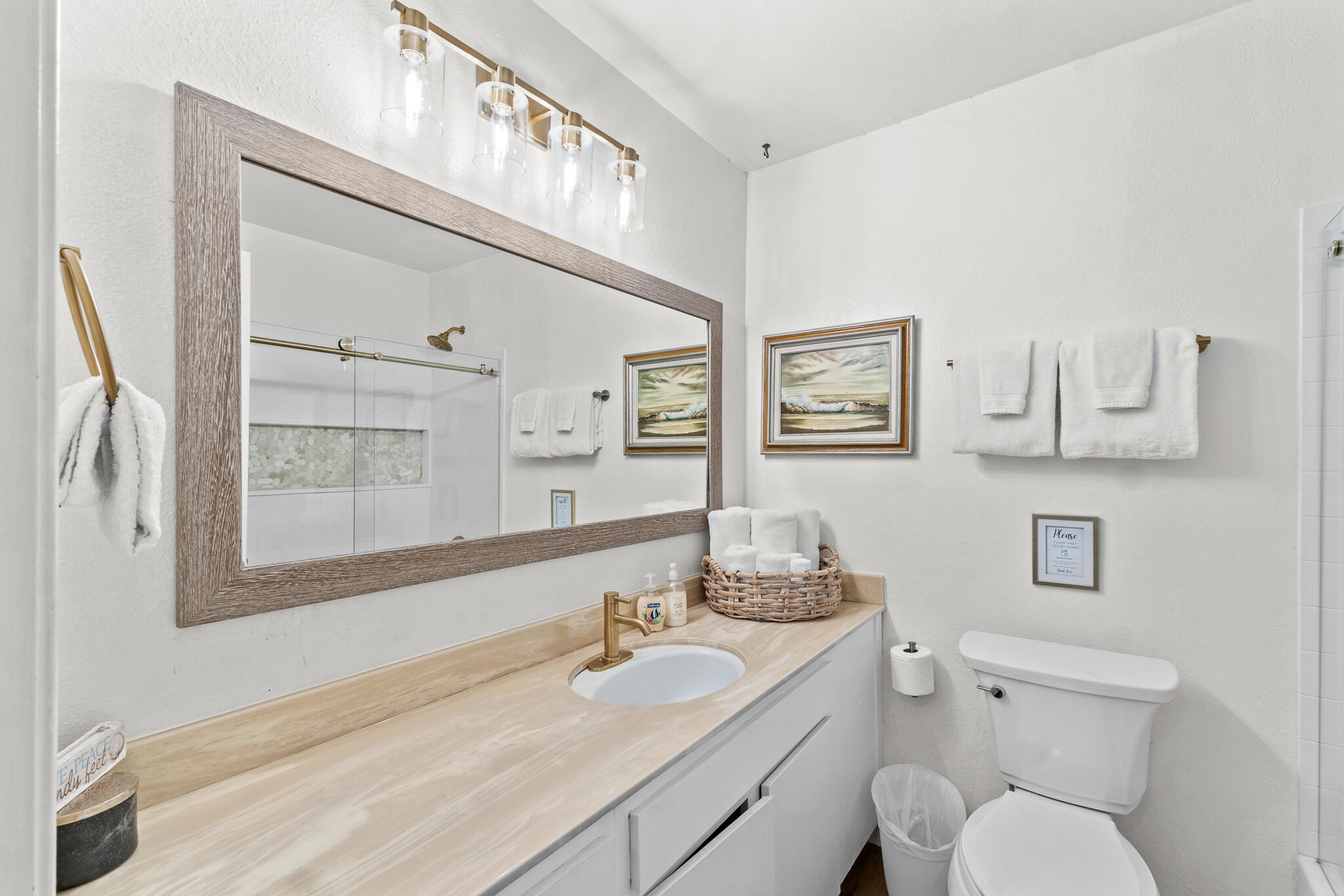 77 North Ocean Avenue, Unit 12 Cayucos, CA 93430 - Photo 28 of 41 a bathroom with a granite countertop toilet sink and mirror