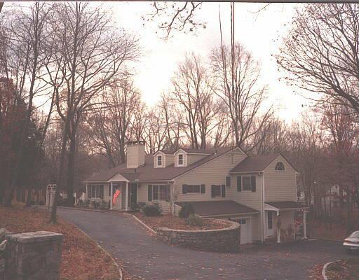482 Rock Rimmon Road Stamford, CT 06903 - Photo 1 of 1 a front view of a house with a trees