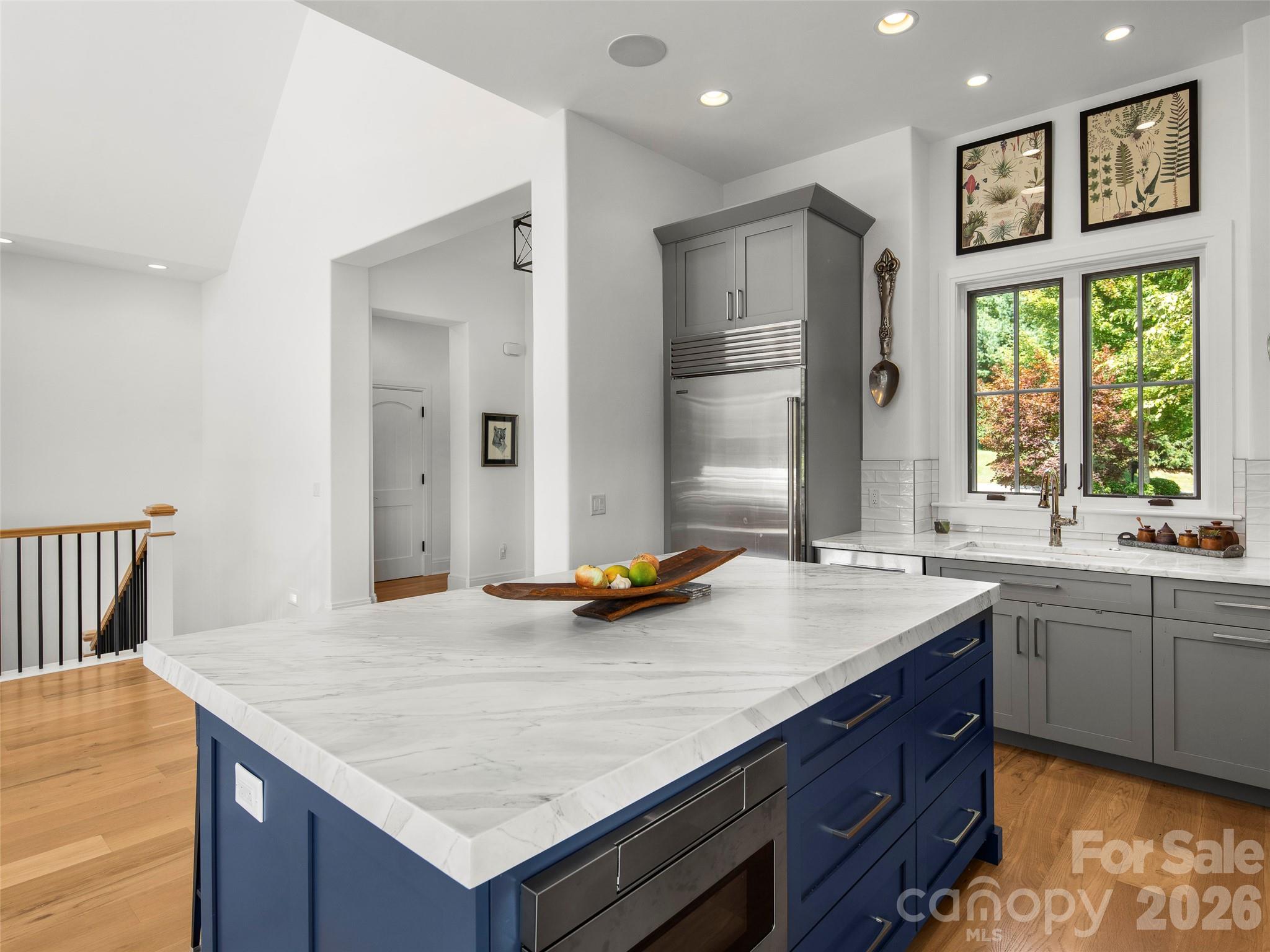 4 Windelsham Way Arden, NC 28704 - Photo 14 of 46 a kitchen with a stove a refrigerator and a sink