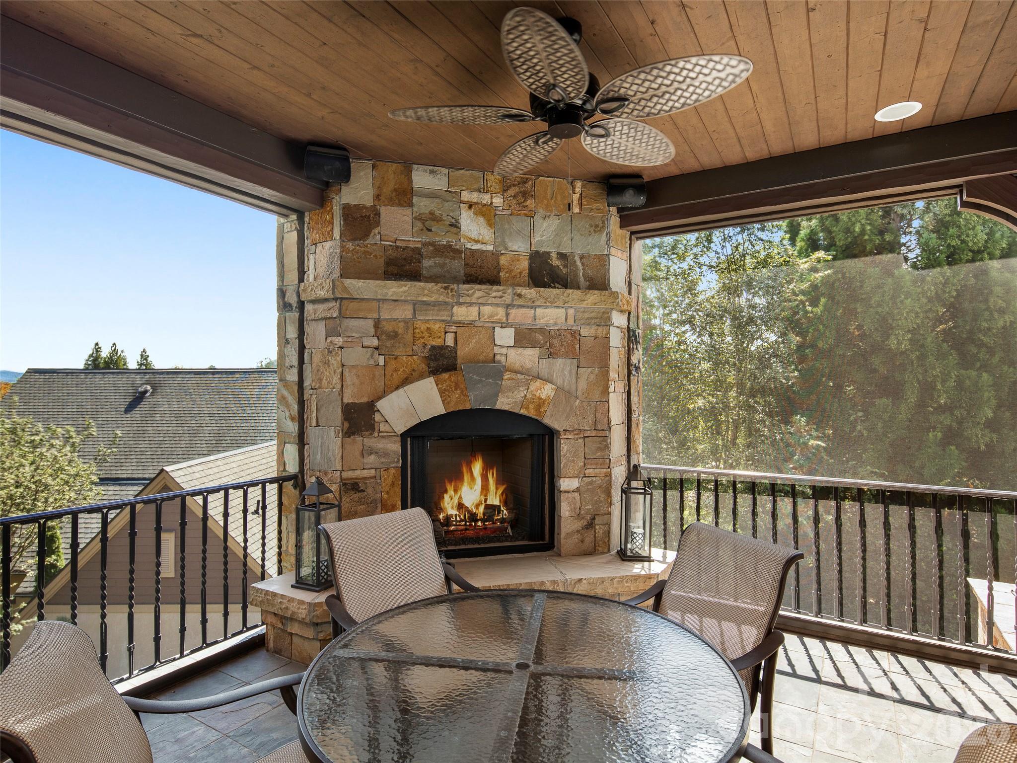 4 Windelsham Way Arden, NC 28704 - Photo 19 of 46 a view of a porch with furniture and a fireplace