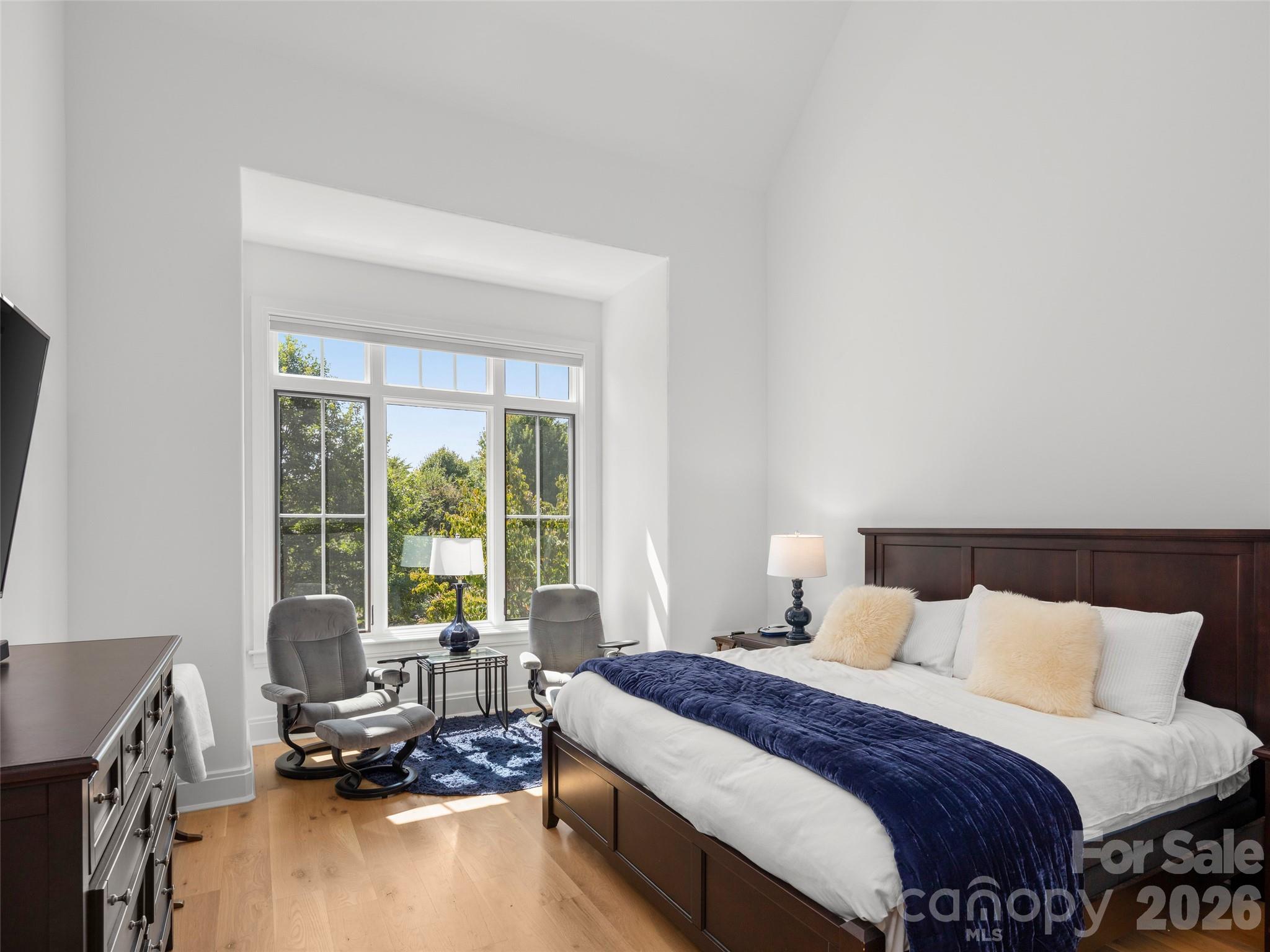 4 Windelsham Way Arden, NC 28704 - Photo 23 of 46 a bedroom with a bed and large windows
