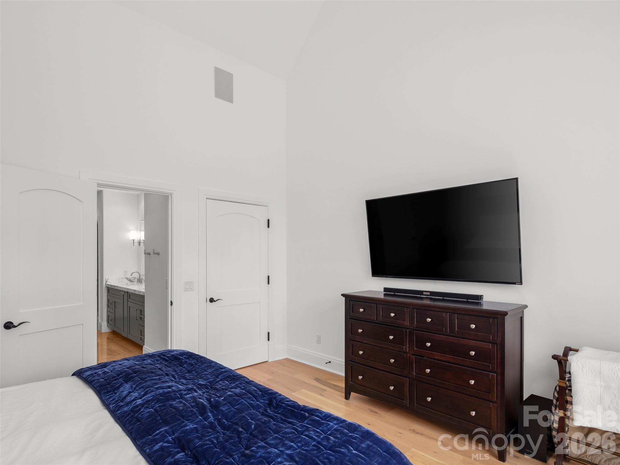 4 Windelsham Way Arden, NC 28704 - Photo 24 of 46 a bedroom with a bed and a flat screen tv
