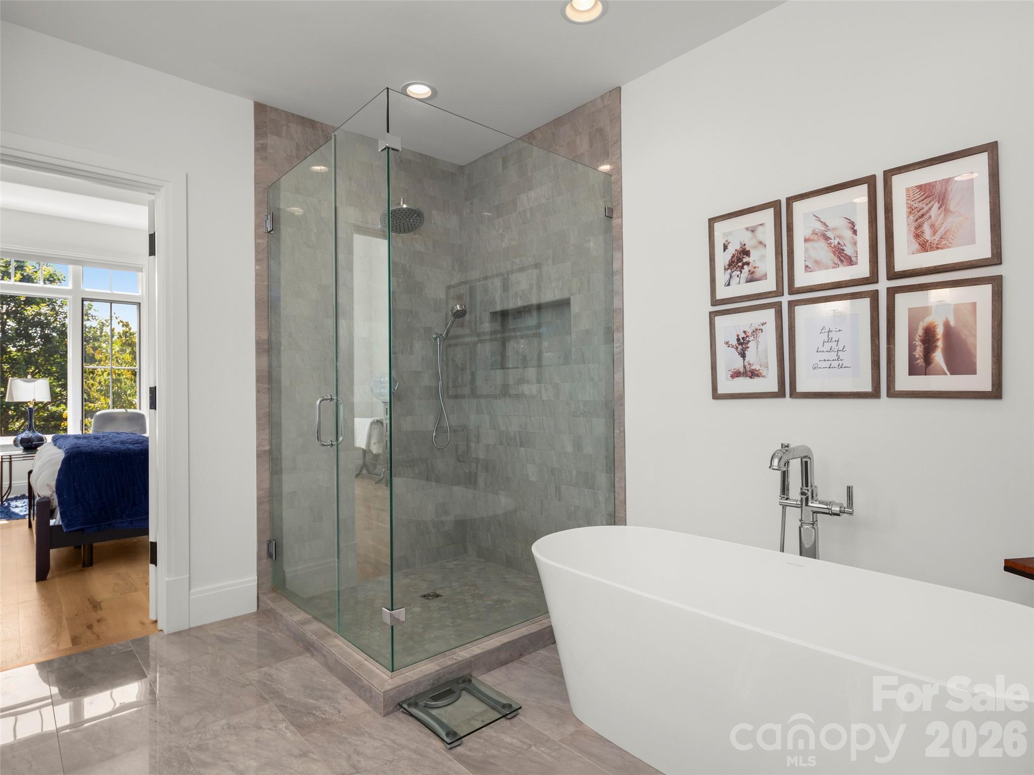 4 Windelsham Way Arden, NC 28704 - Photo 26 of 46 a bathroom with a shower a sink and a mirror