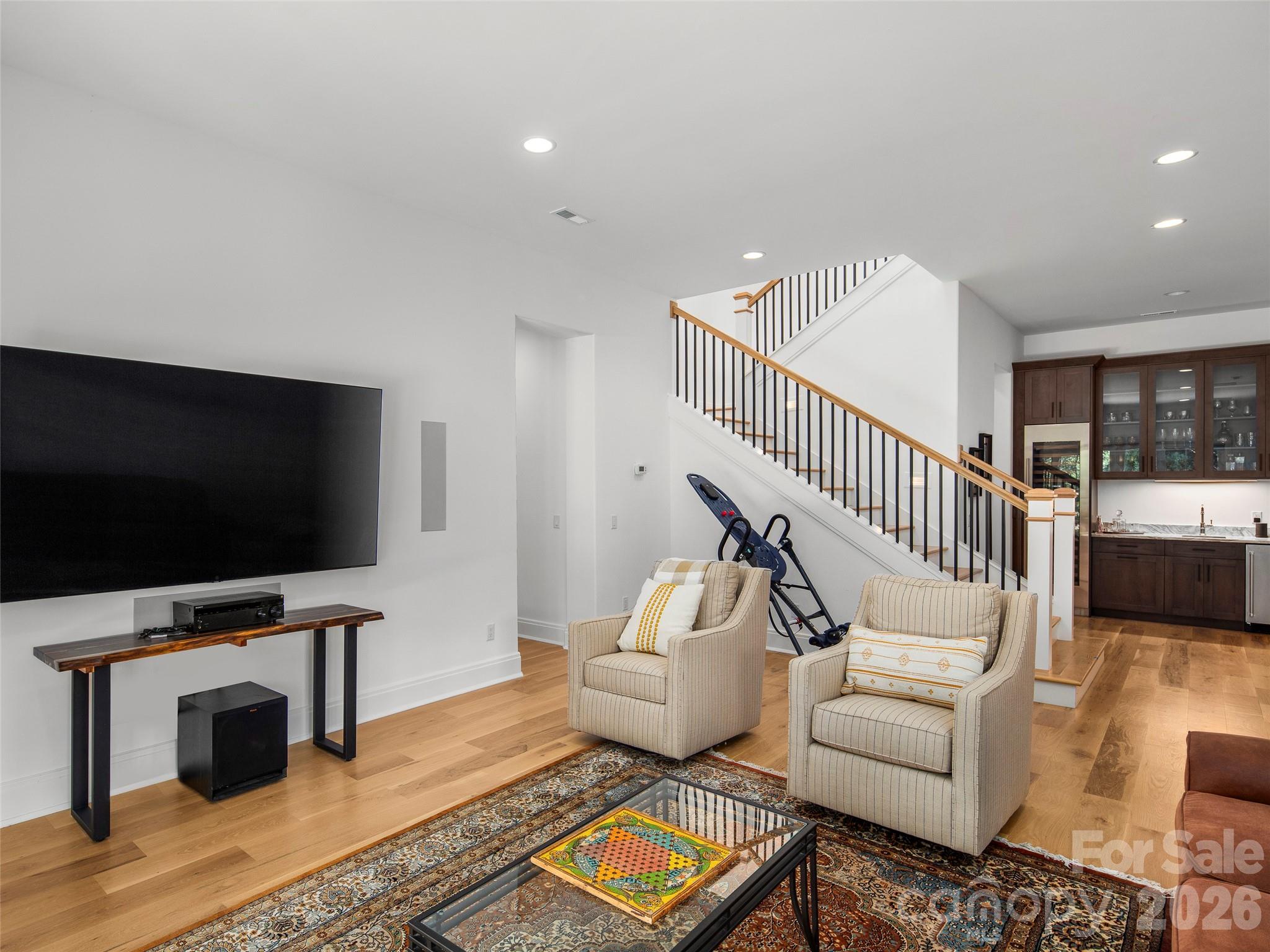 4 Windelsham Way Arden, NC 28704 - Photo 29 of 46 a living room with furniture and a flat screen tv