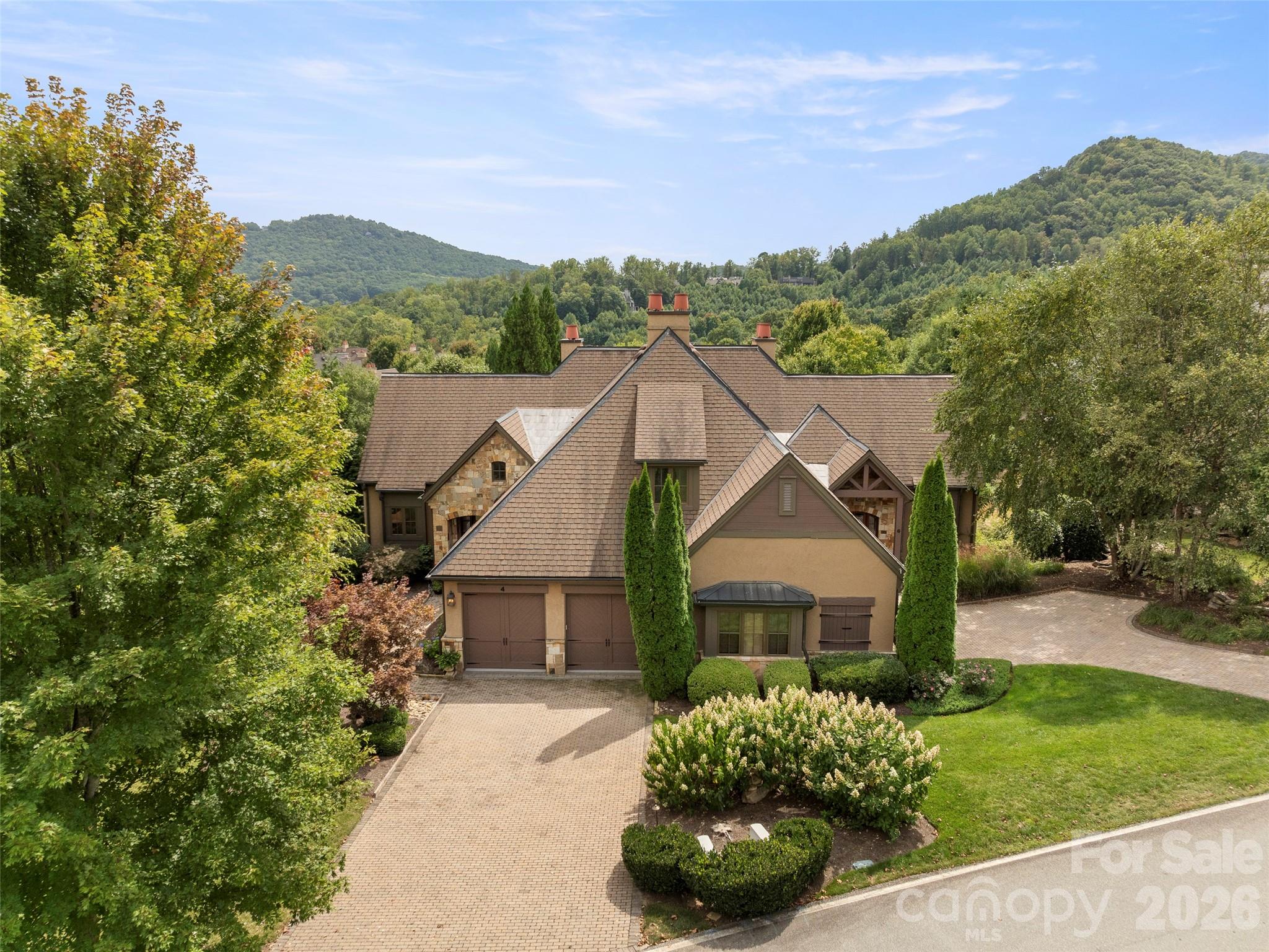 4 Windelsham Way Arden, NC 28704 - Photo 40 of 46 a front view of a house with a yard and mountain
