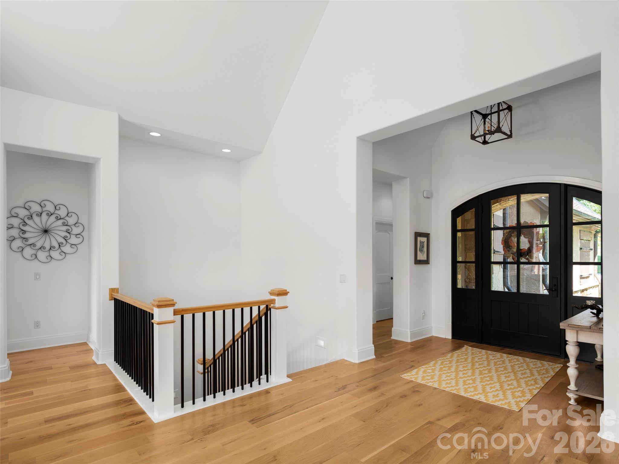 4 Windelsham Way Arden, NC 28704 - Photo 4 of 46 a bedroom with a bed and wooden floor
