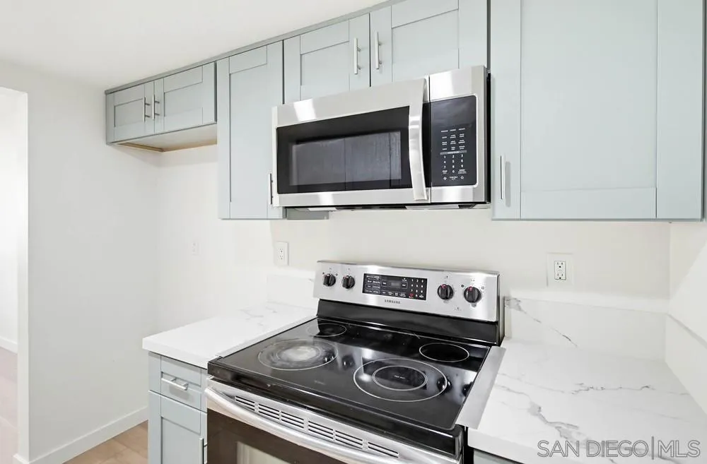 637 R Avenue, Unit 37 National City, CA 91950 - Photo 13 of 27 a kitchen with a stove and a microwave