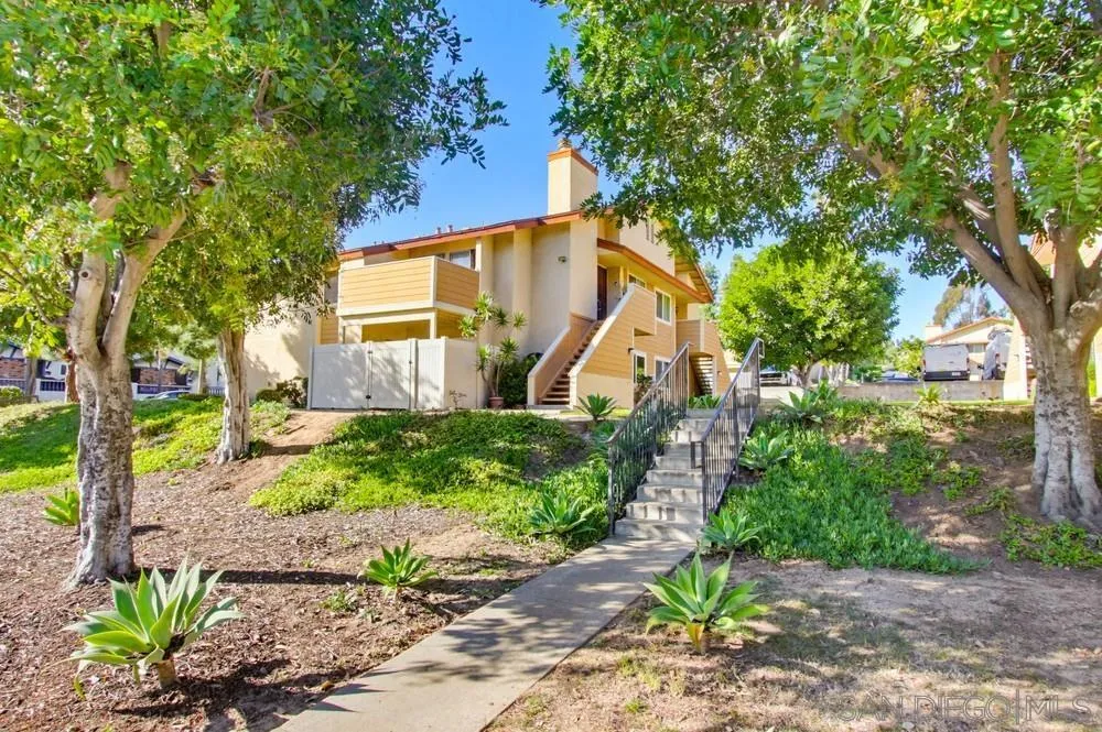 637 R Avenue, Unit 37 National City, CA 91950 - Photo 2 of 27 a view of a house with a backyard and a tree