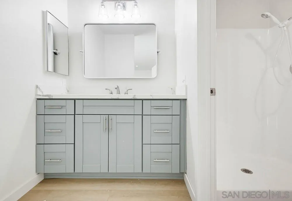 637 R Avenue, Unit 37 National City, CA 91950 - Photo 23 of 27 a bathroom with a sink vanity and mirror