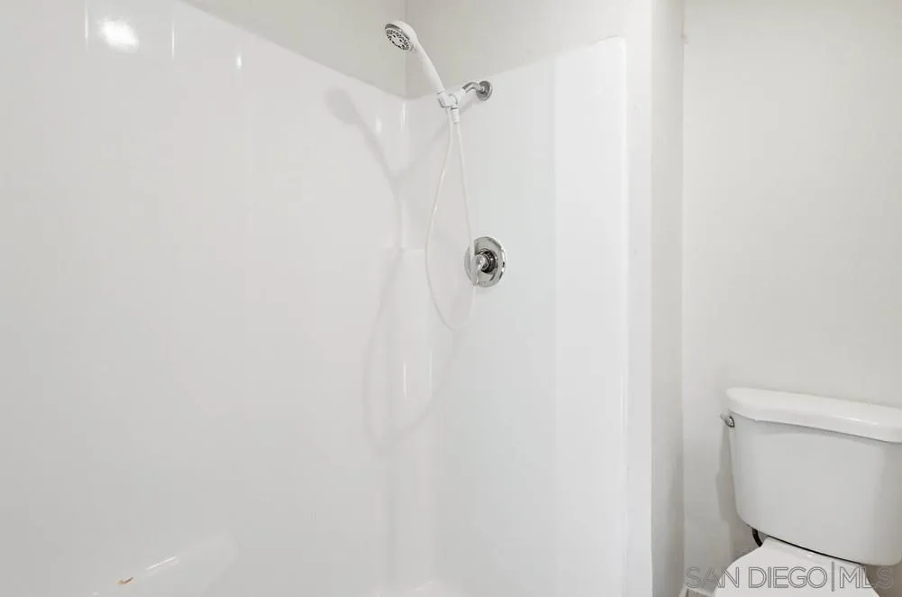 637 R Avenue, Unit 37 National City, CA 91950 - Photo 25 of 27 a white toilet sitting next to a shower