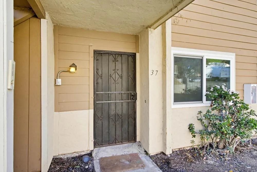 637 R Avenue, Unit 37 National City, CA 91950 - Photo 4 of 27 front view of a house with a glass door