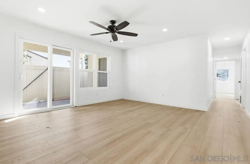 637 R Avenue, Unit 37 National City, CA 91950 - Photo 5 of 27 a view of empty room with wooden floor and fan