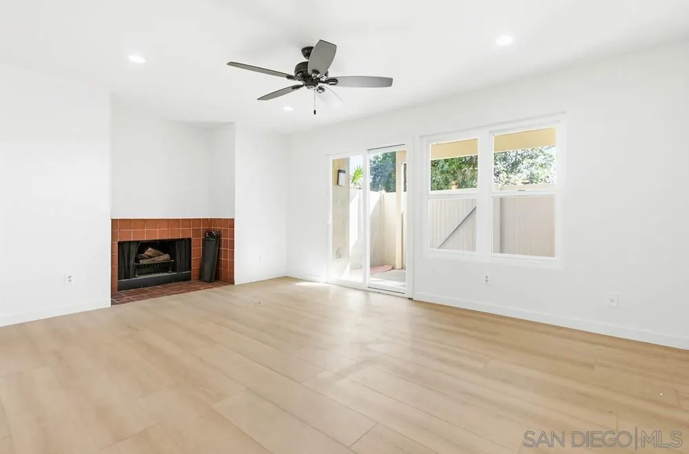 637 R Avenue, Unit 37 National City, CA 91950 - Photo 8 of 27 a view of an empty room with a fireplace and a window
