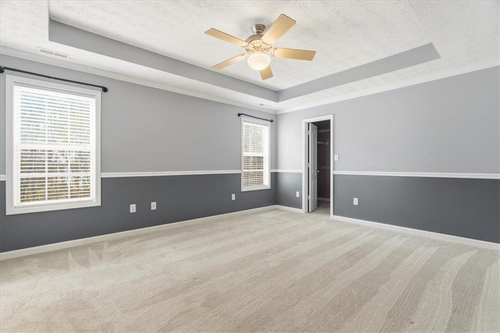 1022 Miss Amber Way Locust Grove, GA 30248 - Photo 16 of 43 a view of an empty room with a window
