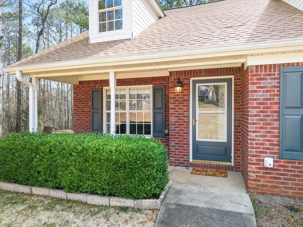 1022 Miss Amber Way Locust Grove, GA 30248 - Photo 2 of 43 a view of a house with large windows