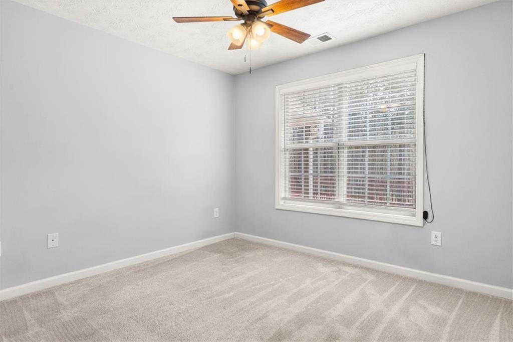 1022 Miss Amber Way Locust Grove, GA 30248 - Photo 25 of 43 a view of an empty room with a window