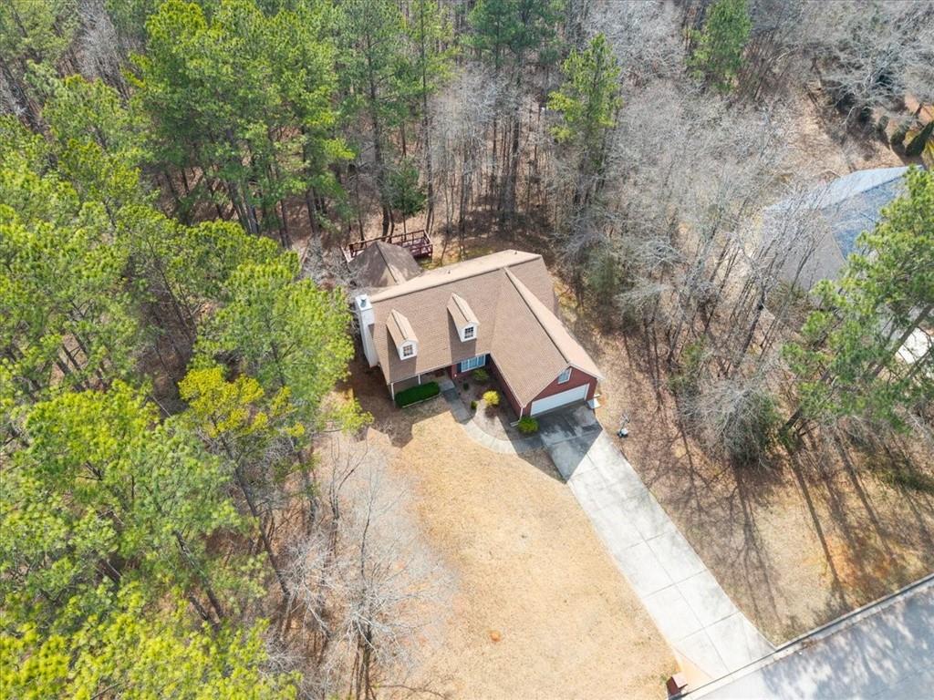 1022 Miss Amber Way Locust Grove, GA 30248 - Photo 41 of 43 a view of a backyard with chairs and a small yard