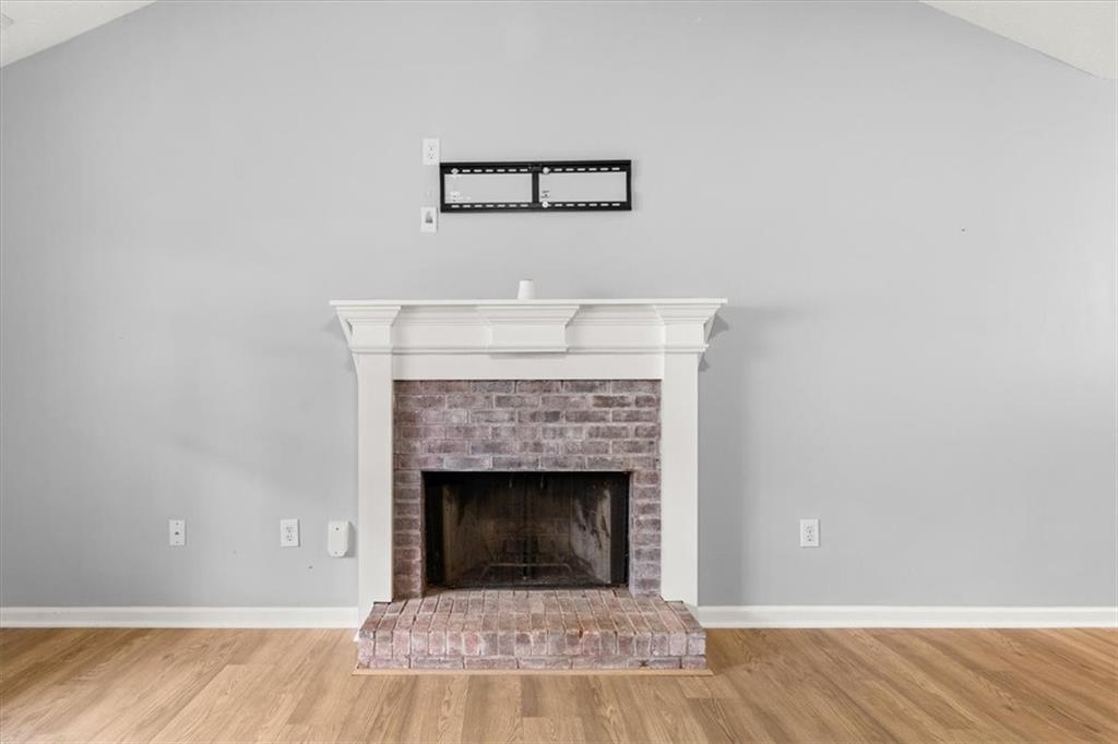 1022 Miss Amber Way Locust Grove, GA 30248 - Photo 6 of 43 a view of a livingroom with a fireplace