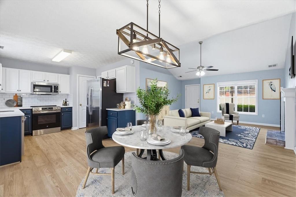 1022 Miss Amber Way Locust Grove, GA 30248 - Photo 8 of 43 a view of a dining room with furniture