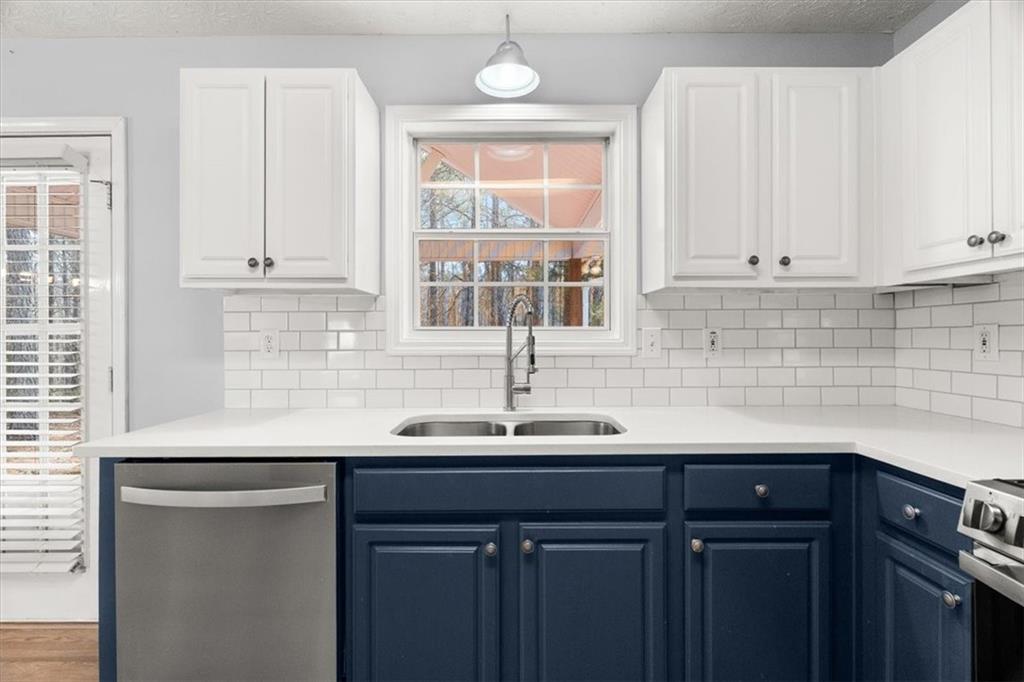 1022 Miss Amber Way Locust Grove, GA 30248 - Photo 10 of 43 a sink with white cabinets