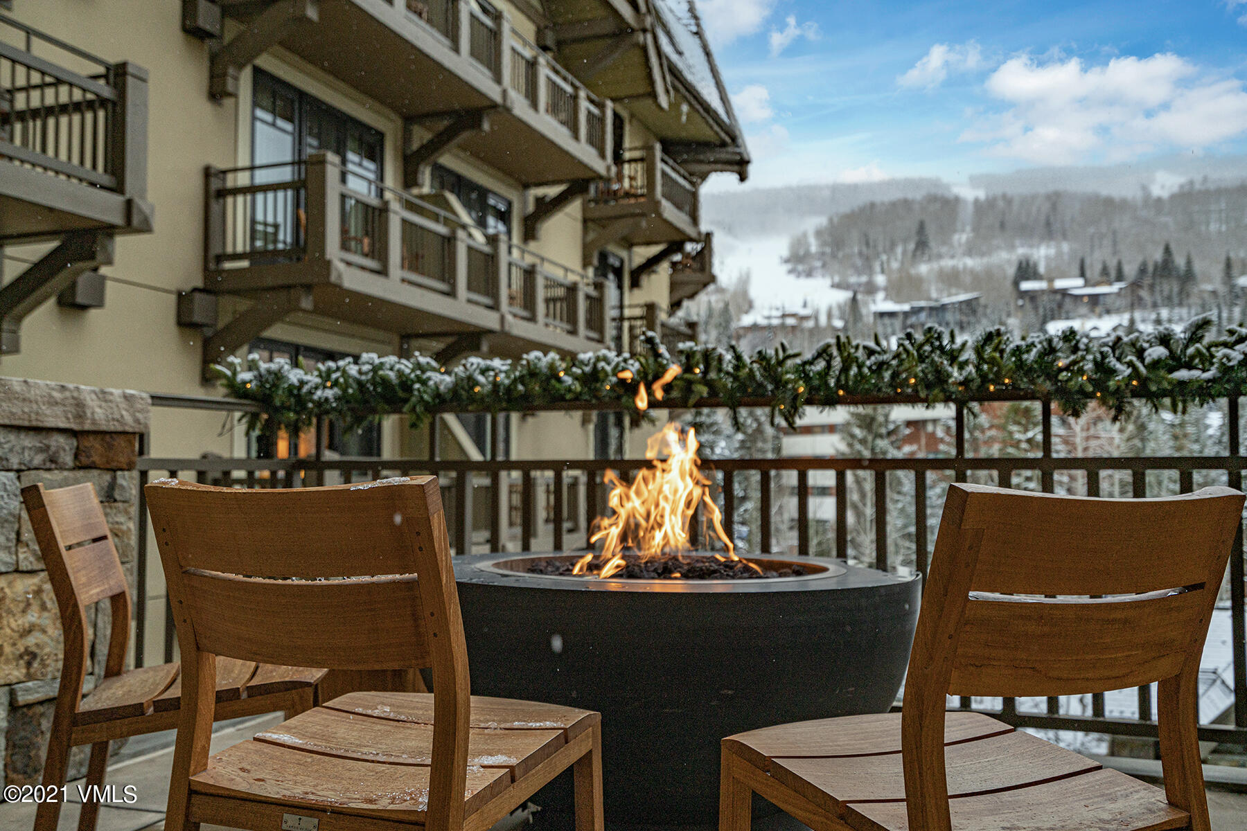 1 Vail Road, Unit 8034 Vail, CO 81657 - Photo 4 of 5 a view of a chairs and table in the terrace